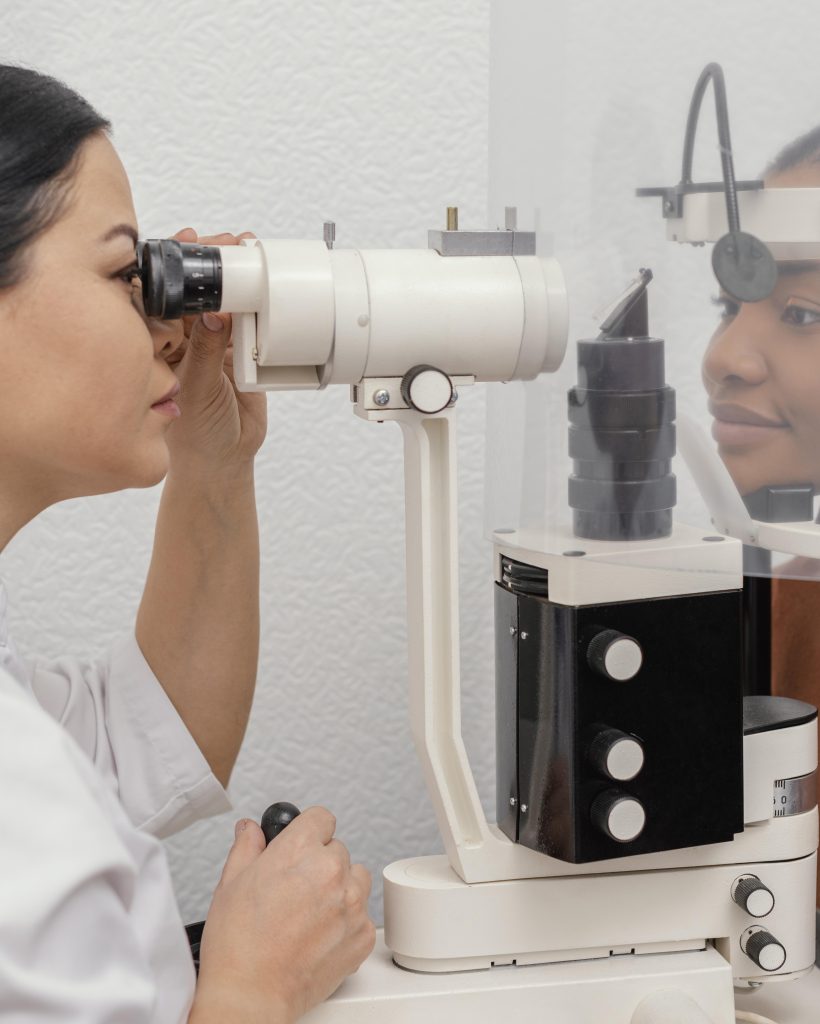 close-up-doctor-checking-woman-eyes
